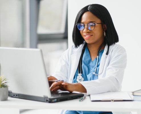 Doctor working a computer in her office